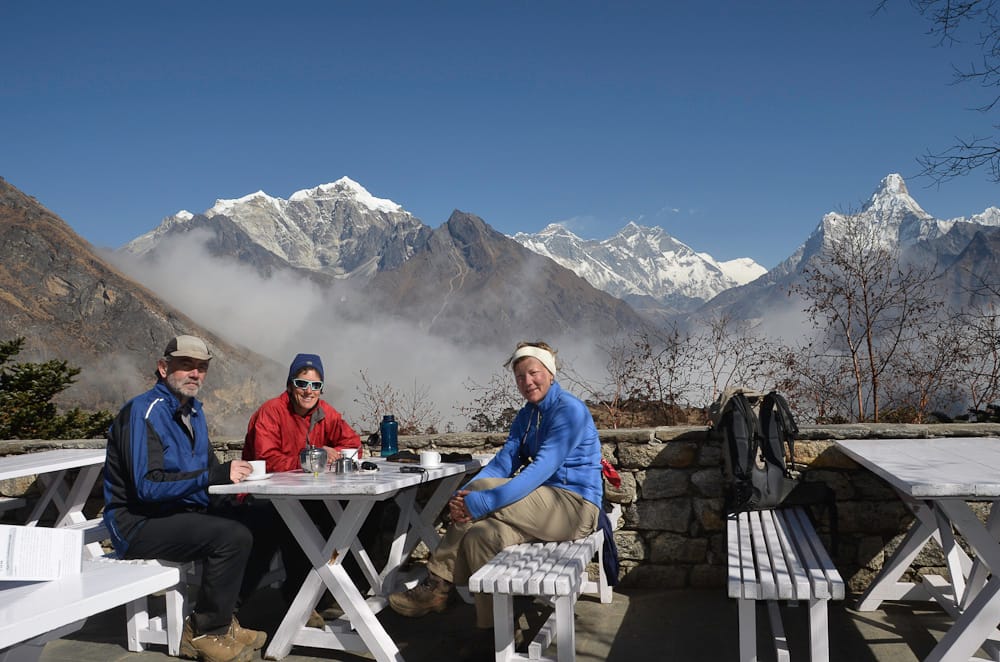 Trekkers enjoying panoramic Everest view from the terrace of Everest View Hotel.